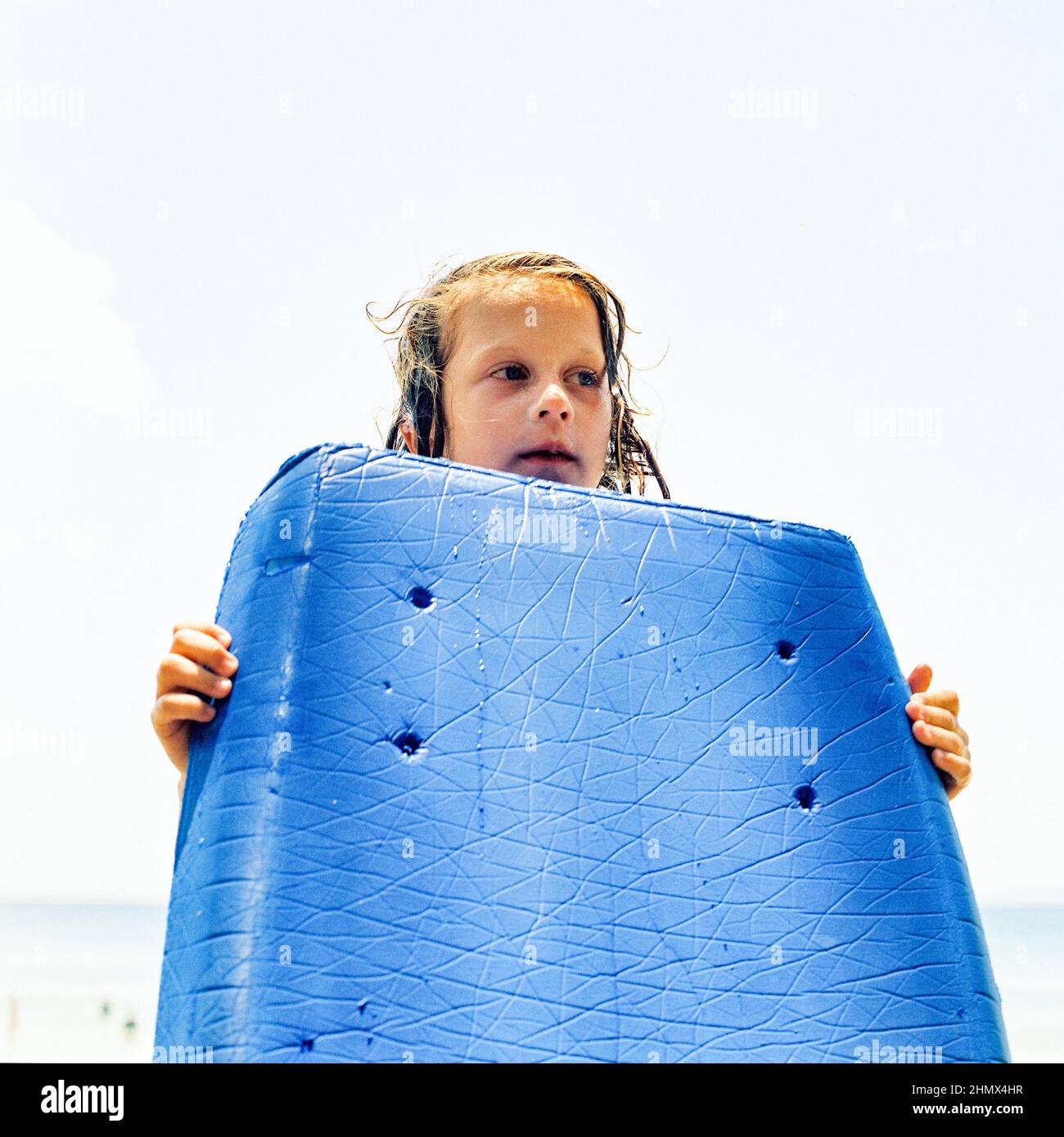 Girl with a bodyboard, Noosa beach, Queensland, Australia Stock Photo