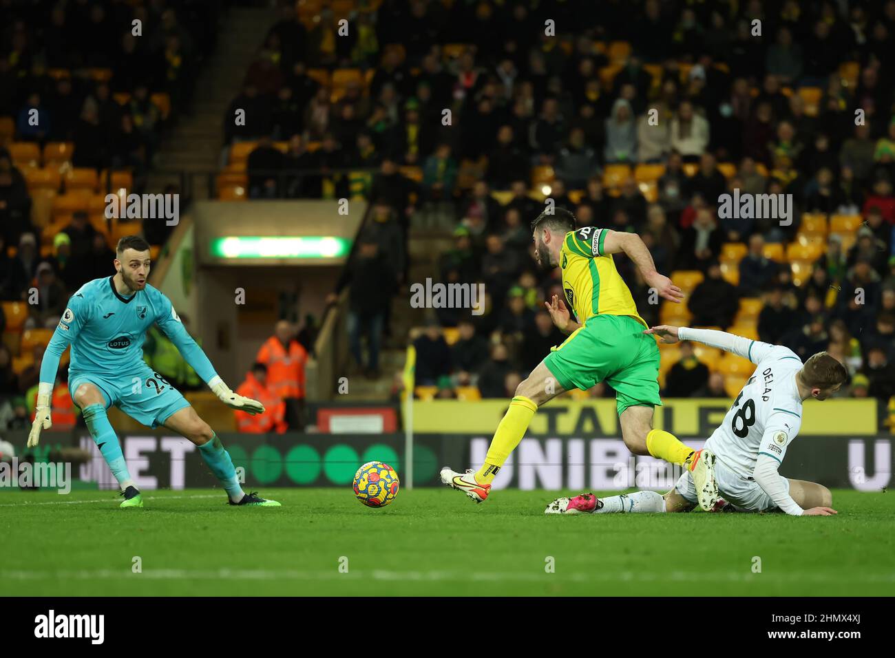 Norwich, UK. 12th February 2022 ;  Carrow Road, Norwich, Norforlk, England; Premier League football, Norwich versus Manchester City; Grant Hanley of Norwich City brings down Liam Delap of Manchester City for a penalty Credit: Action Plus Sports Images/Alamy Live News Stock Photo