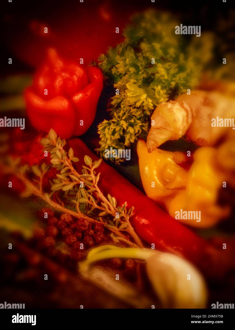 High resolution colourful food still life featuring ginger, thyme, garlic and scotch Bonnet peppers Stock Photo
