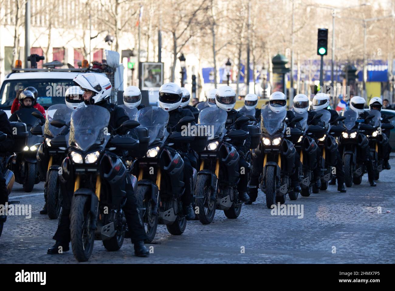 Polices Forces riding motorbikes on the Champs Elysees in Paris near the Arc de Triomphe on February 12, 2022 as convoys of protesters so called Convoi de la Liberte arrived in the French capital. Thousands of protesters in convoys, inspired by Canadian truckers paralysing border traffic with the US, were heading to Paris from across France on February 11, with some hoping to blockade the capital in opposition to Covid-19 restrictions despite police warnings to back off. The protesters include many anti-Covid vaccination activists, but also people protesting against fast-rising energy prices t Stock Photo