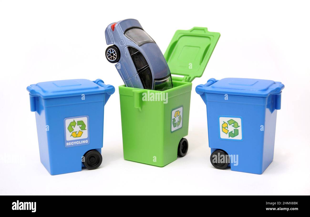 MODEL CAR IN RECYCLING BIN RE SCRAPPING SCRAPPAGE SCHEMES RECYCLING PARTS THE ENVIRONMENT EV'S ELECTRIC CARS ETC UK Stock Photo