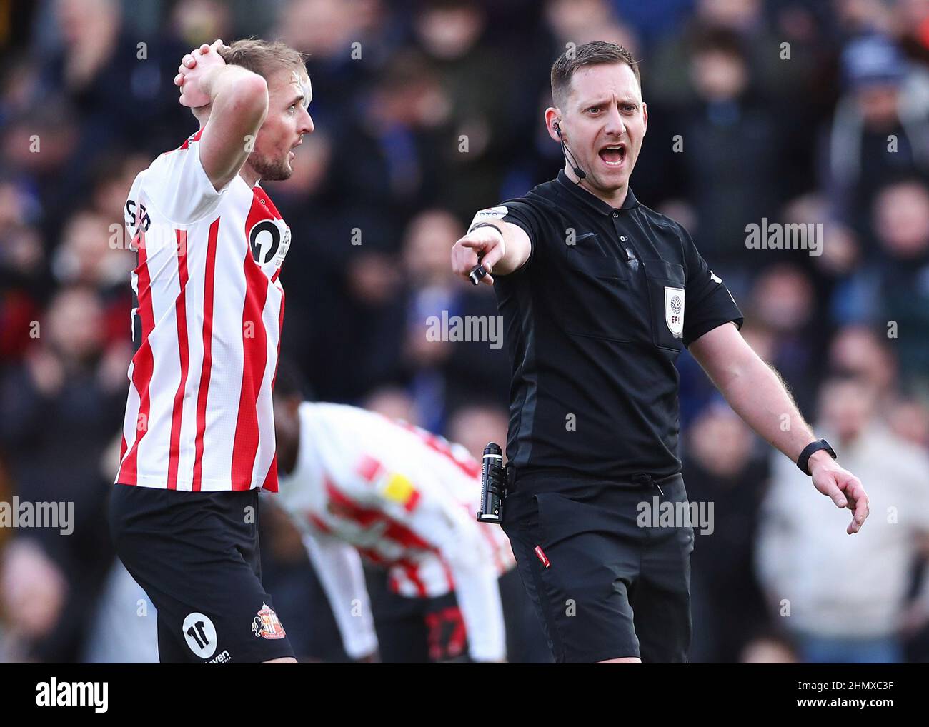 Sunderland's Carl Winchester (left) reacts as referee Simon Mather awards a penalty to AFC Wimbledon during the Sky Bet League One match at The Cherry Red Records Stadium, London. Picture date: Saturday February 12, 2022. Stock Photo