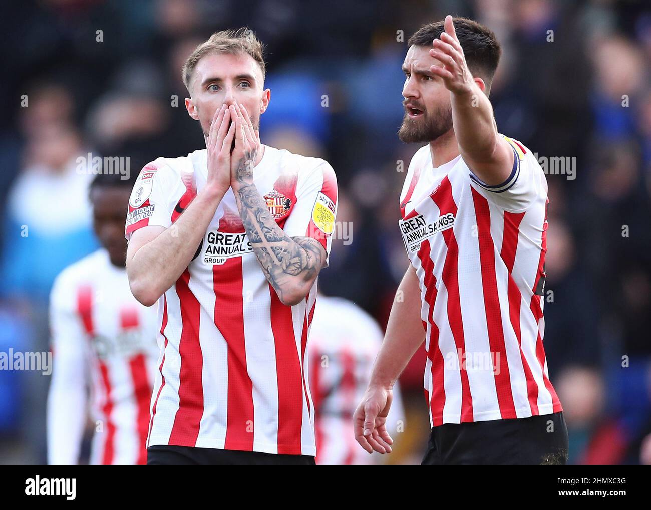 Sunderland's Carl Winchester (left) and Bailey Wright react as the referee awards a penalty to AFC Wimbledon during the Sky Bet League One match at The Cherry Red Records Stadium, London. Picture date: Saturday February 12, 2022. Stock Photo