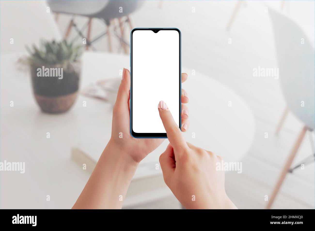 Female hand using blank touchscreen of smart phone. Isolated display in white for app design presentation Stock Photo