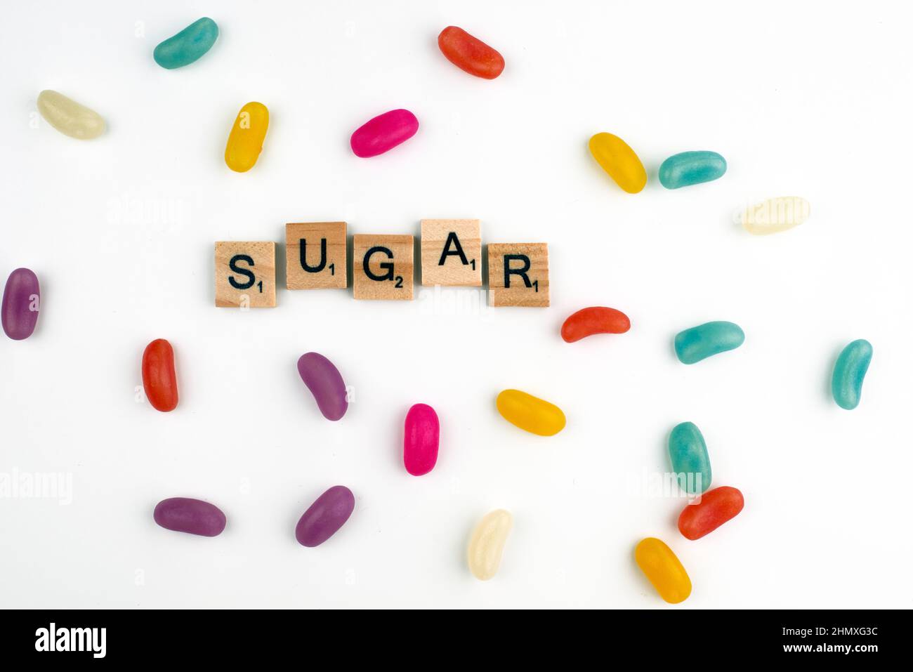 London, UK - February 12th 2022: Sugar scrabble tiles sign surrounded by candy Stock Photo