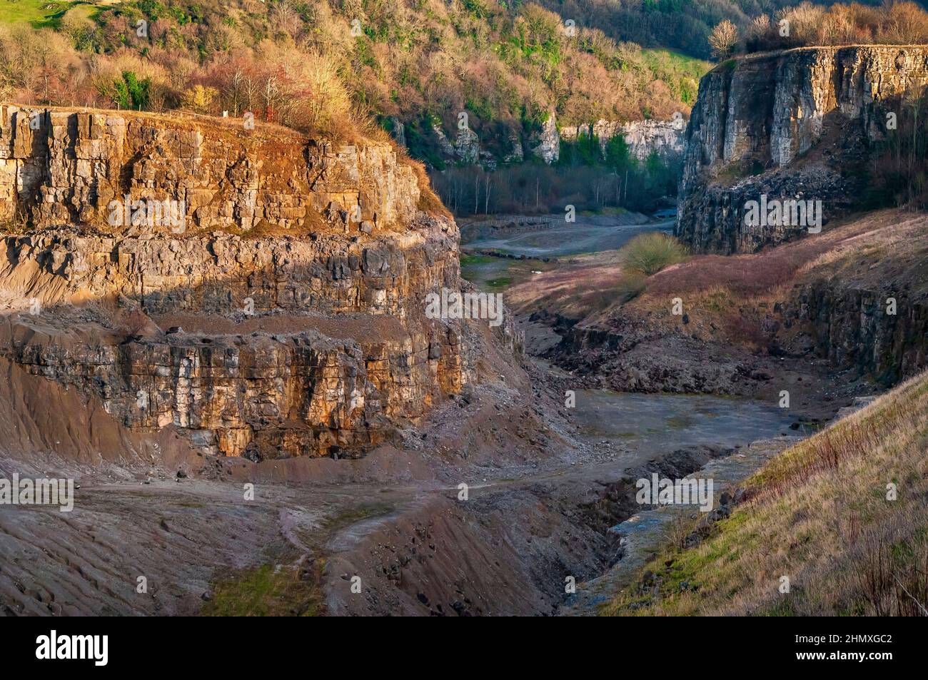 The dramatic restored remains of Goddard's limestone quarry, in bright winter sunshine, at Stoney Middleton, Derbyshire. Stock Photo