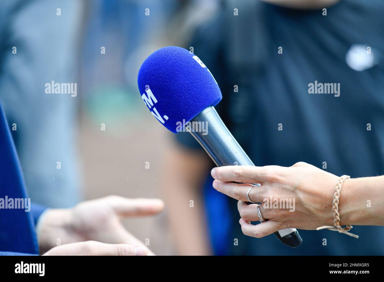 Microphone illustration (mic or mike) of French free-to-air TV news  journalist channel "BFM TV" (or "BFMTV") during the annual "Campus des  Jeunes Repu Stock Photo - Alamy