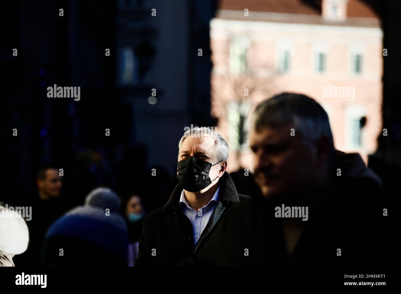 A man wearing a face mask is seen in the Old Town of Warsaw, Poland on 12 February, 2022. Minister of Health Adam Niedzielski this week announced the Stock Photo