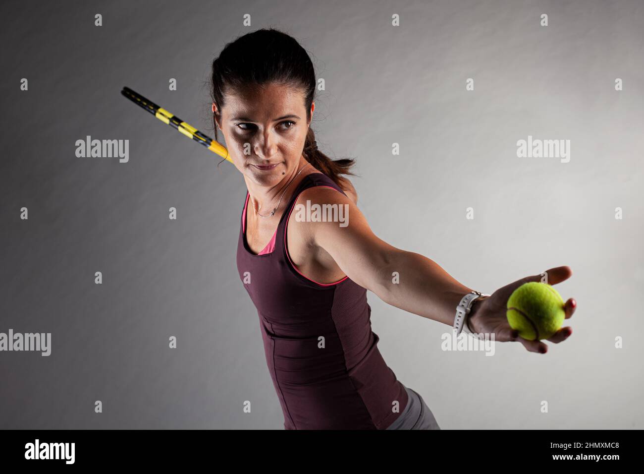 Professional female tennis player. Girl swinging racket preparing to ...