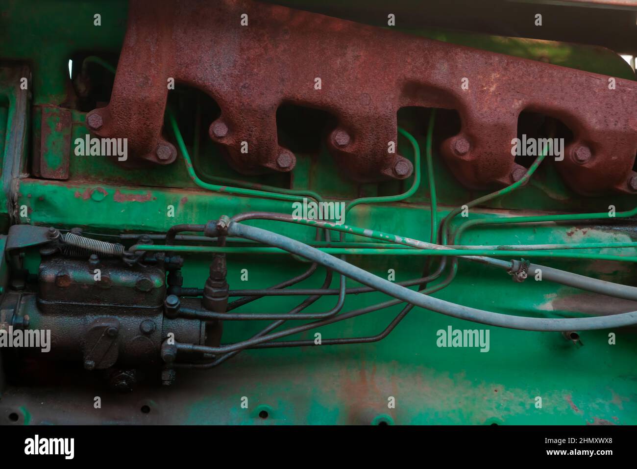 John Deere tire of tractor on field. Agricultural tractor wheel closeup