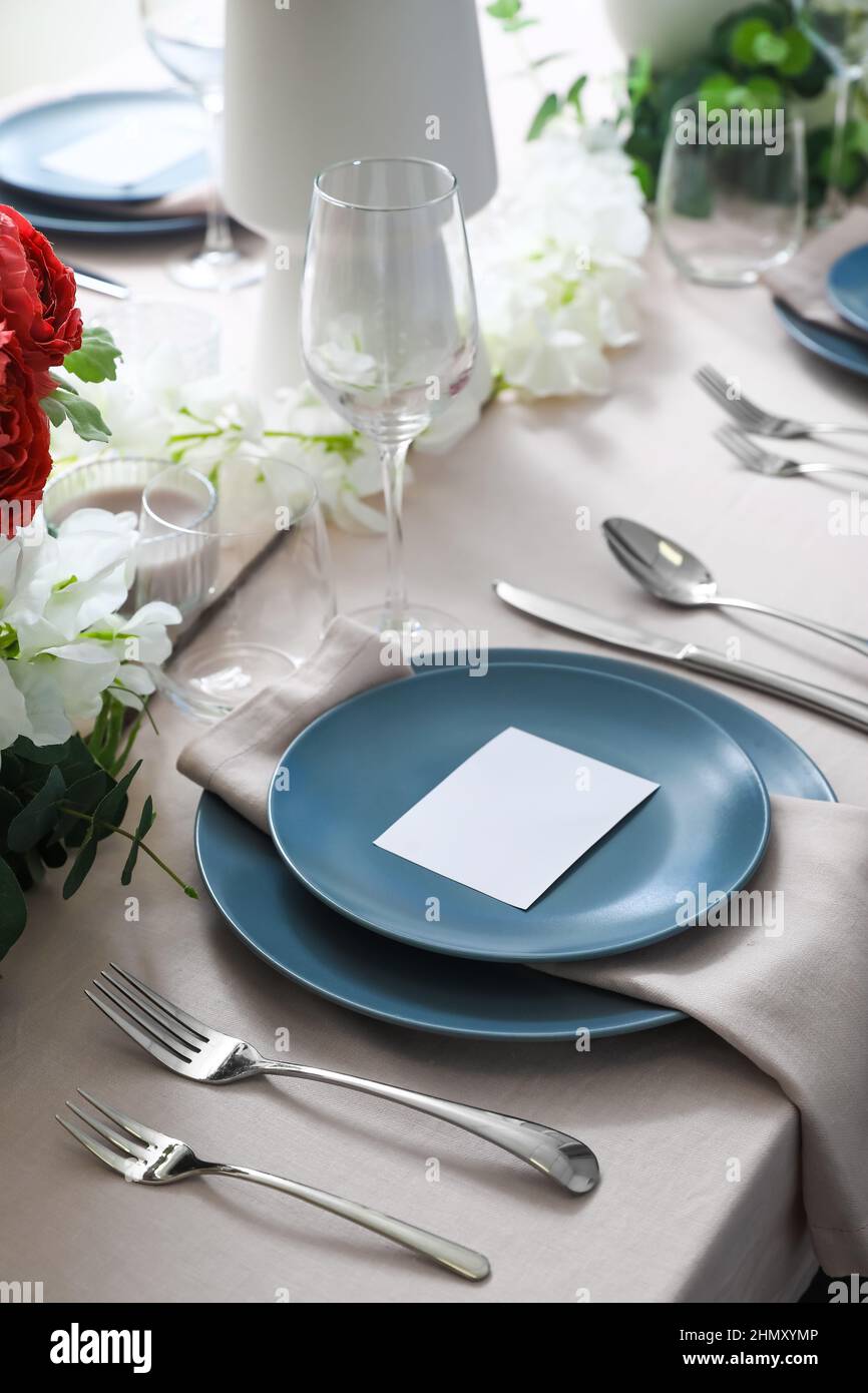 Stylish table setting with blank card Stock Photo