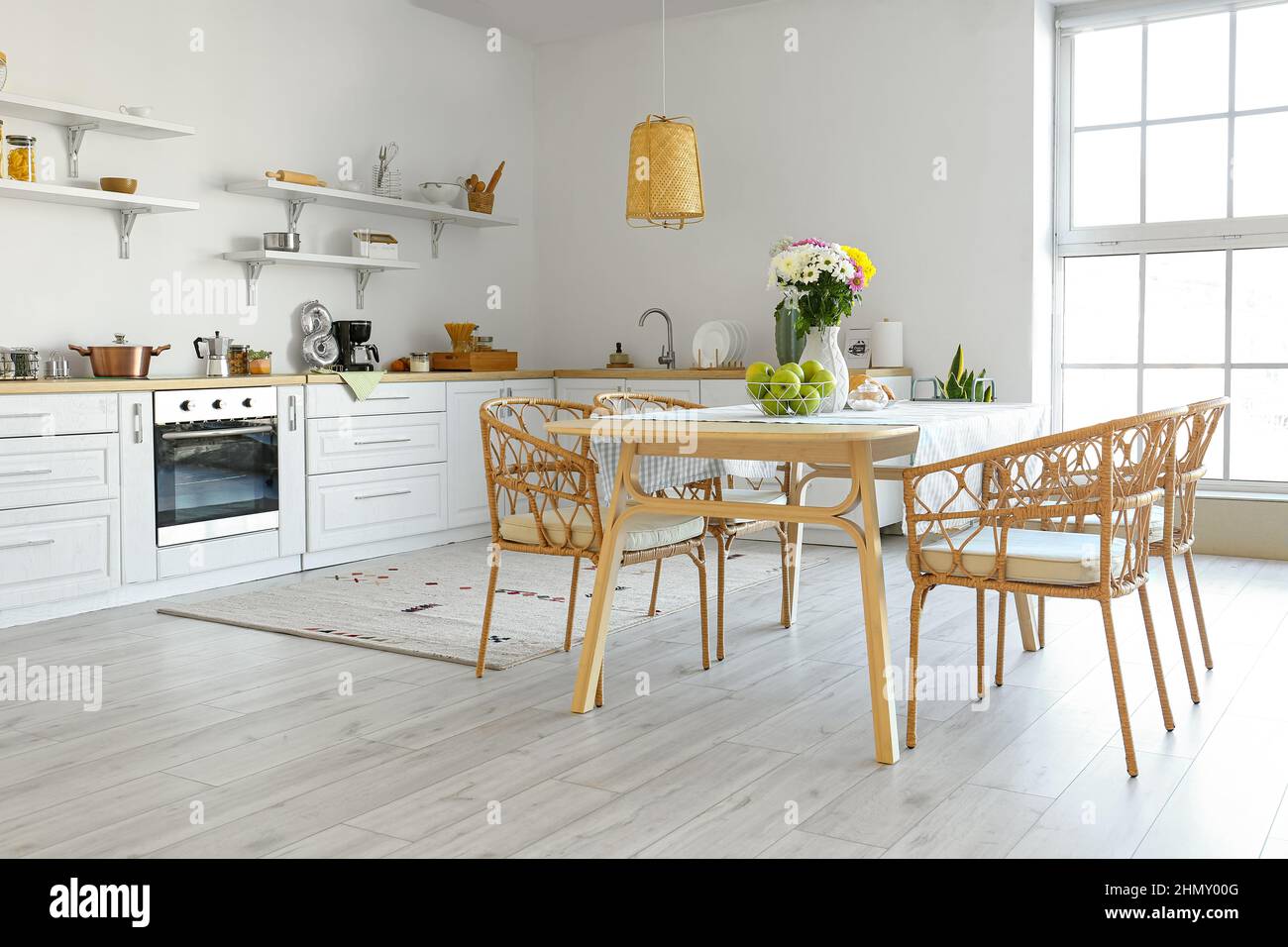 Interior of modern kitchen with dining table and beautiful ...