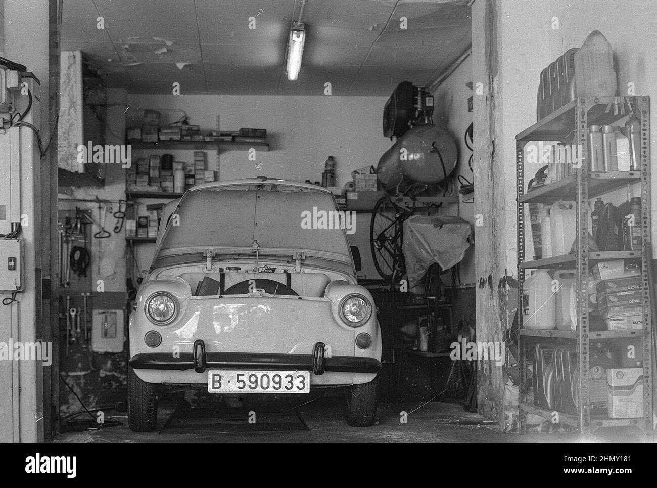 Photo of a classic Italian car, typical Fiat 500 in a workshop Stock Photo