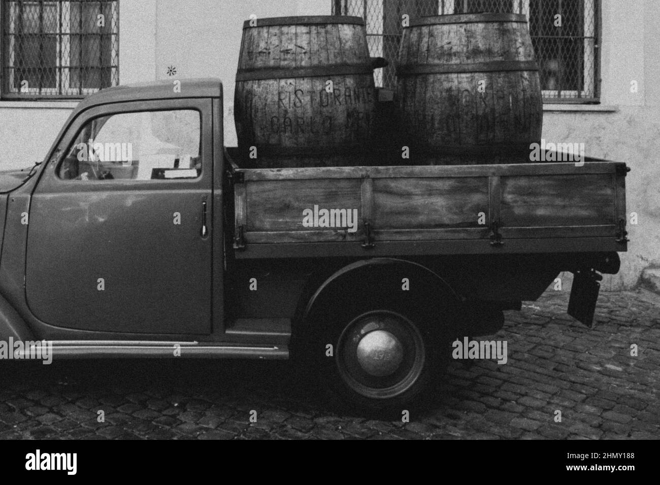 Greyscale photo of the back an old van pick up with wooden box, model Fiat 1100 ELR Stock Photo