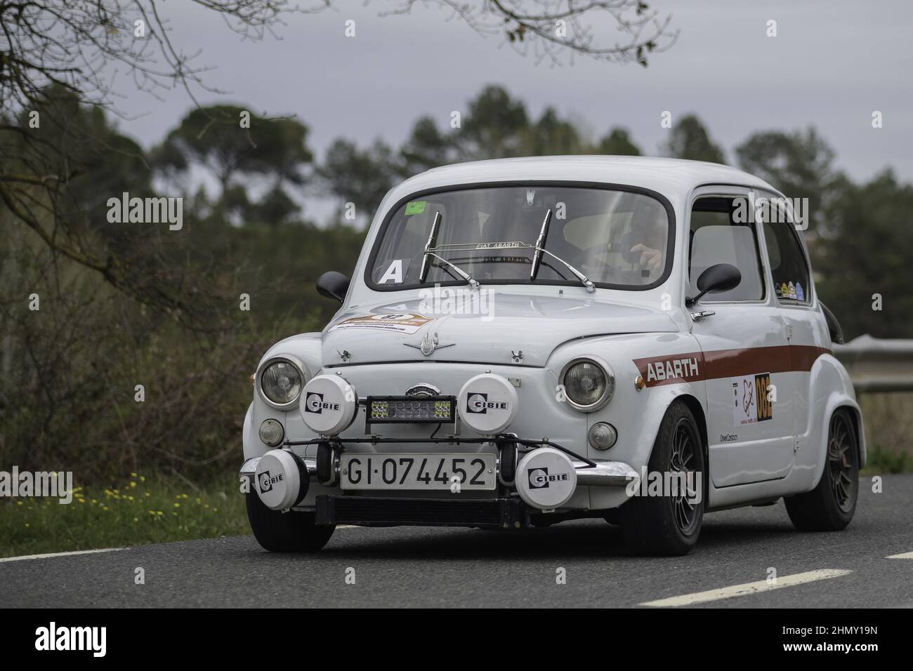 Photo of a white Fiat 600 classic rally car in the street Stock Photo