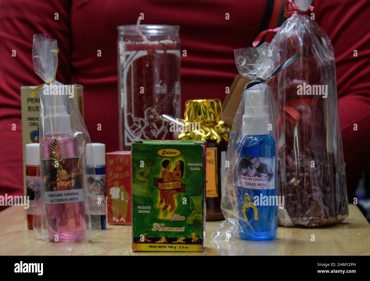 A woman from the Sonora Market offers esoteric products to make love spells for people who want to recover their old partners during the eve of the Va Stock Photo