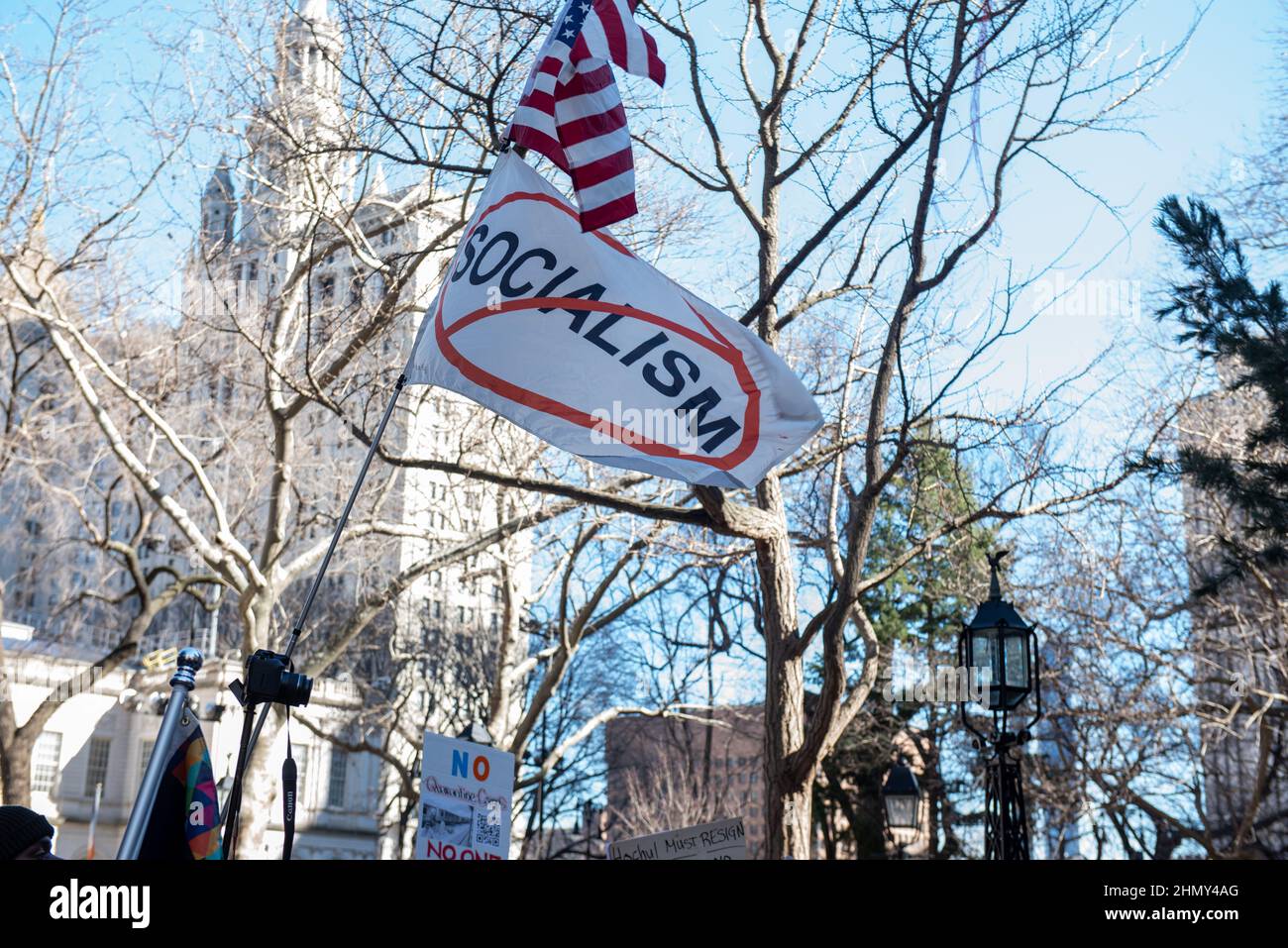 New York, NY, USA - February 11, 2022: Anti-Socialism flag flies as demonstrators gather at City Hall to protest New York City’s vaccine mandate Stock Photo