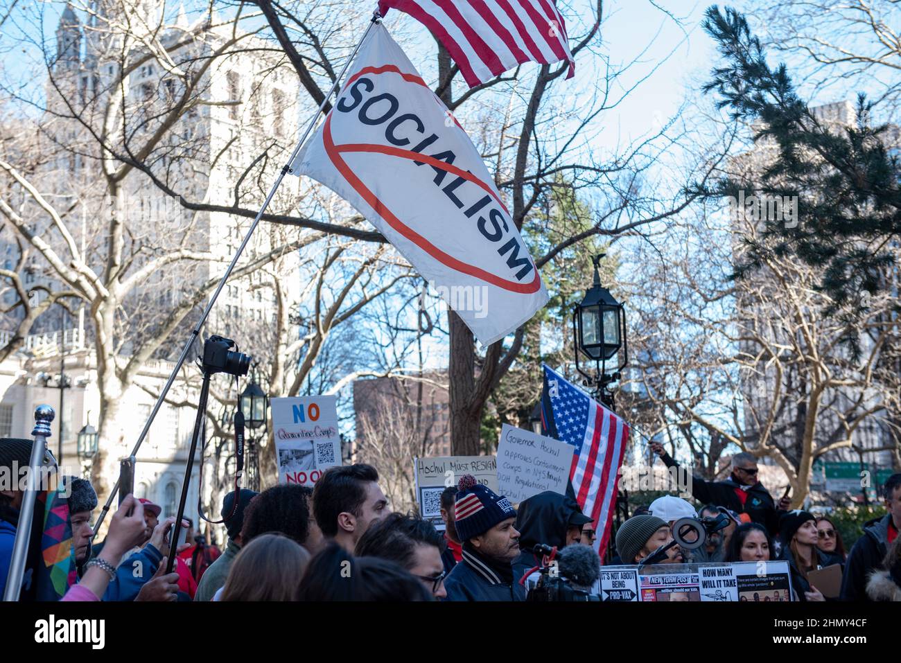 New York, NY, USA - February 11, 2022: Anti-Socialism flag flies as demonstrators gather at City Hall to protest New York City’s vaccine mandate Stock Photo