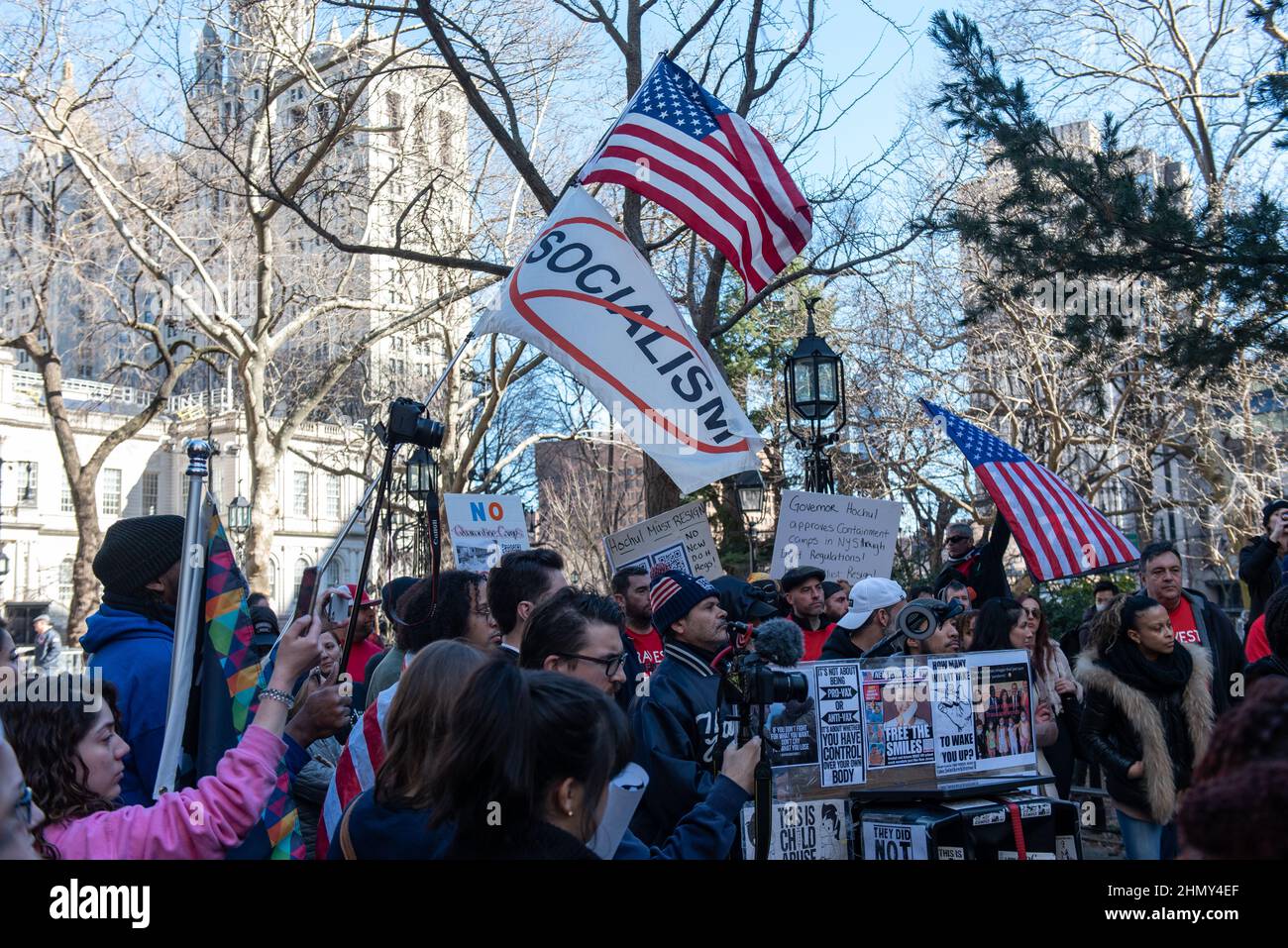 New York, NY, USA - February 11, 2022: Anti-Socialism flag flies as demonstrators gather at City Hall to protest New York City’s vaccine mandate Stock Photo