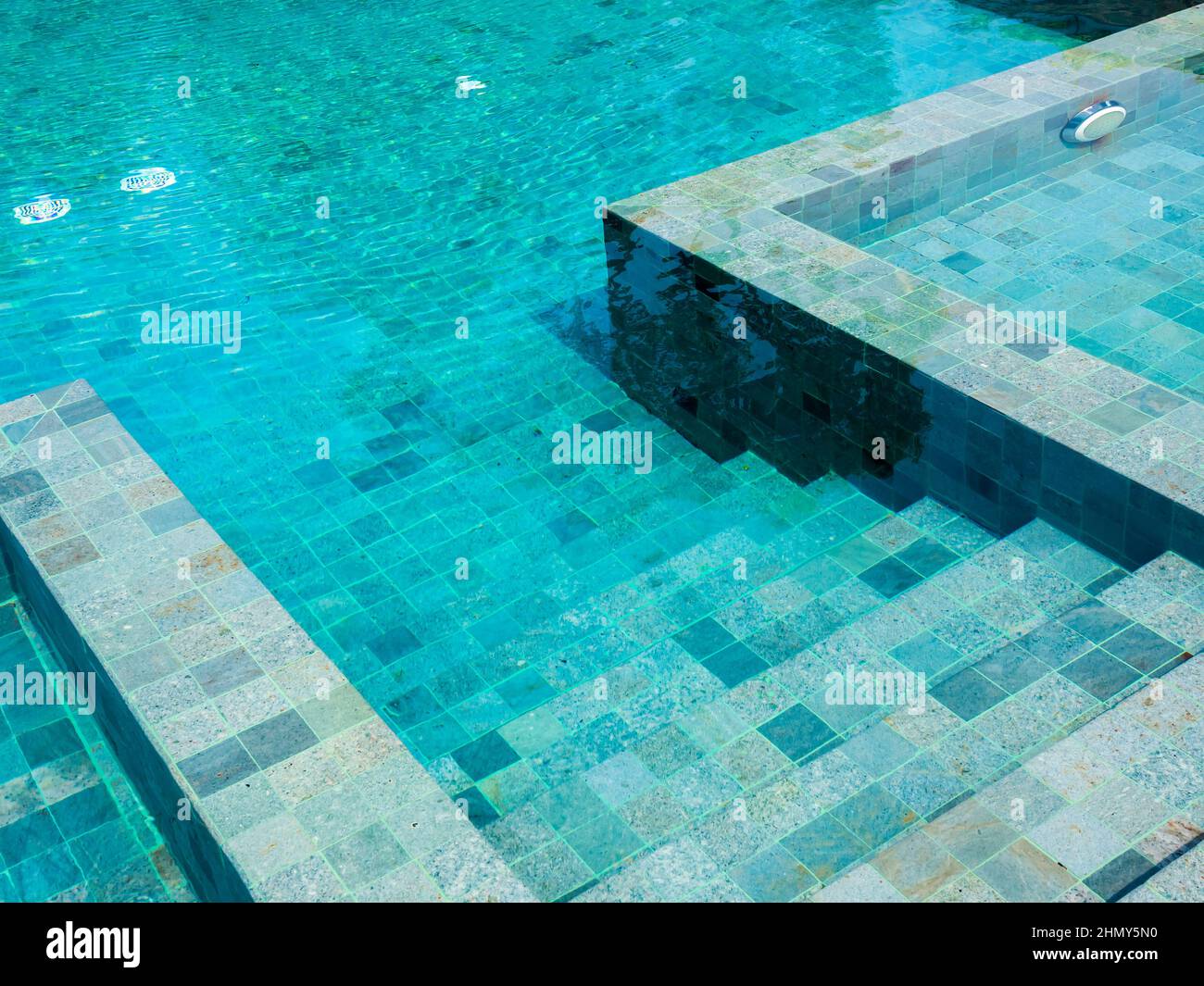 Swimming pool steps with clear water surface background, nobody