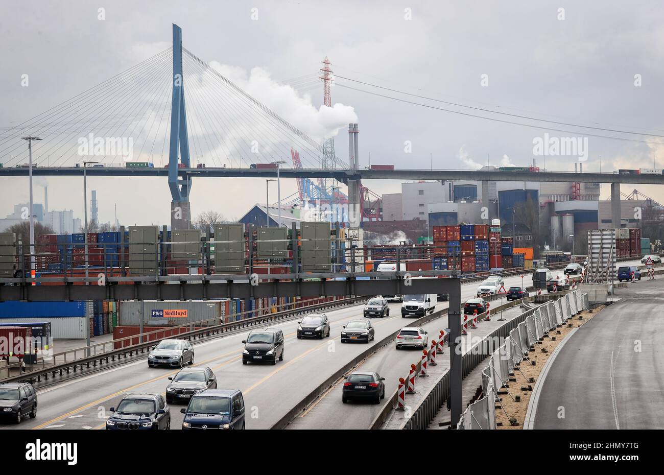 11 February 2022, Hamburg: Traffic flows on different lanes of the A7 freeway south of the Elbe Tunnel. Due to construction work south of the Elbe Tunnel, the A7 will be fully closed from Feb. 18 (10 p.m.) to Feb. 21 (5 a.m.) between the Hamburg-Volkspark and -Heimfeld interchanges. During the weekend, all six lanes are to be transferred to the new K30 West (r) embankment. Construction can then begin on the other half of the ramp, the new link between the Elbe Tunnel and the Elbmarsch elevated highway. At around four kilometers long, the Elbmarsch elevated highway is the longest road bridge in Stock Photo