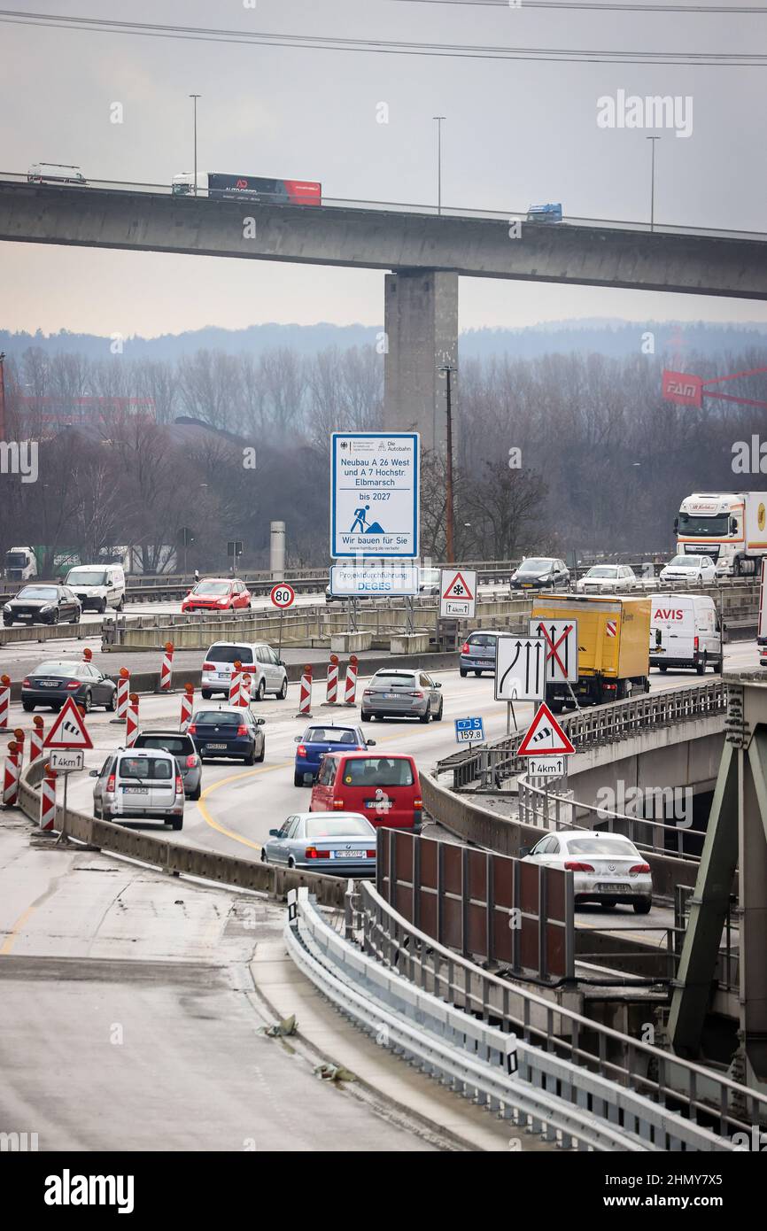 11 February 2022, Hamburg: Traffic flows on different lanes of the A7 freeway south of the Elbe Tunnel. Due to construction work south of the Elbe Tunnel, the A7 will be fully closed from Feb. 18 (10 p.m.) to Feb. 21 (5 a.m.) between the Hamburg-Volkspark and -Heimfeld interchanges. During the weekend, all six lanes will be moved to the new K30 West embankment. Construction of the other half of the ramp, the new link between the Elbe Tunnel and the Elbmarsch elevated highway, can then begin. At around four kilometers long, the Elbmarsch elevated highway is the longest road bridge in Germany. P Stock Photo