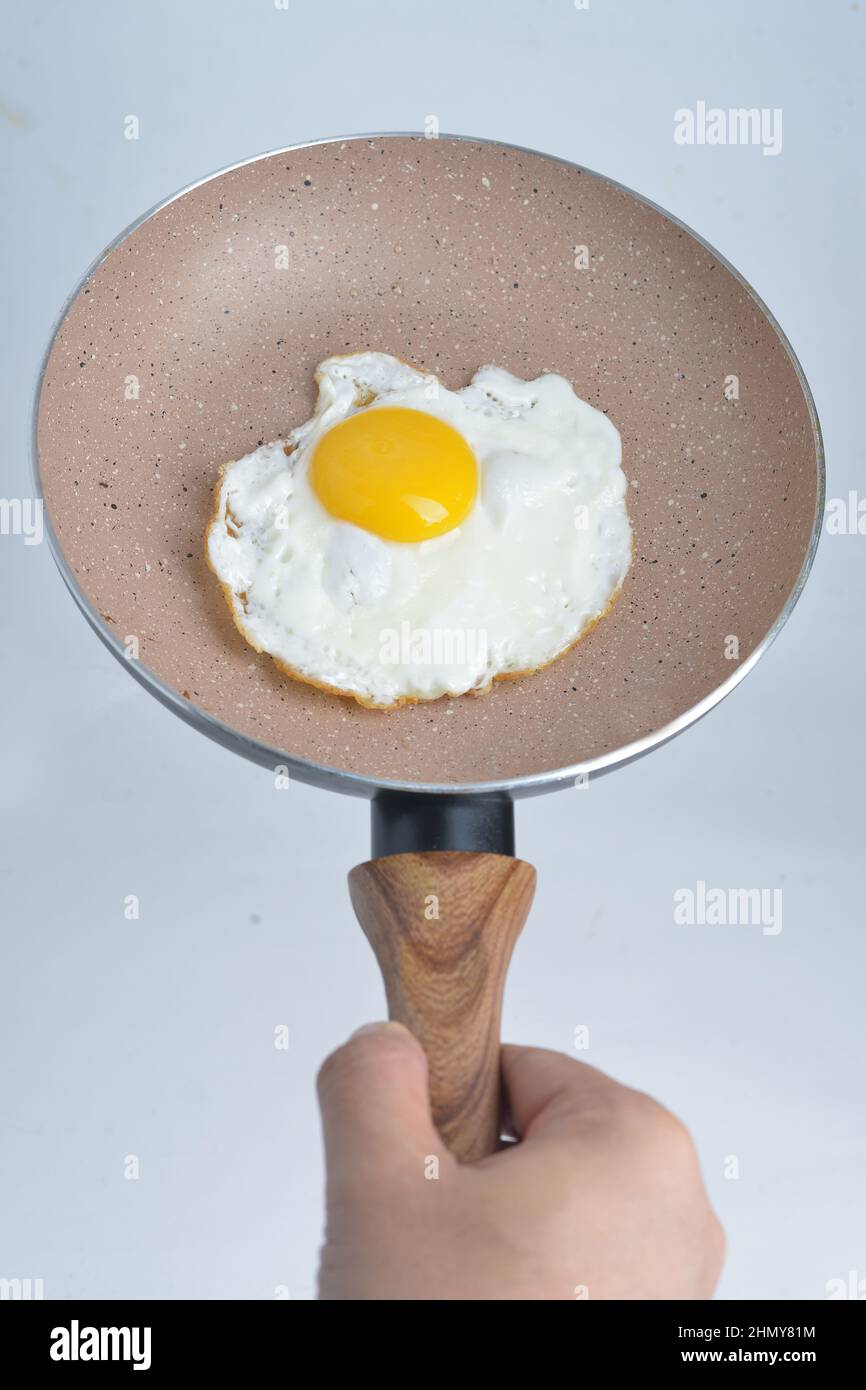 sunny side egg in a pan, isolated white background Stock Photo Alamy