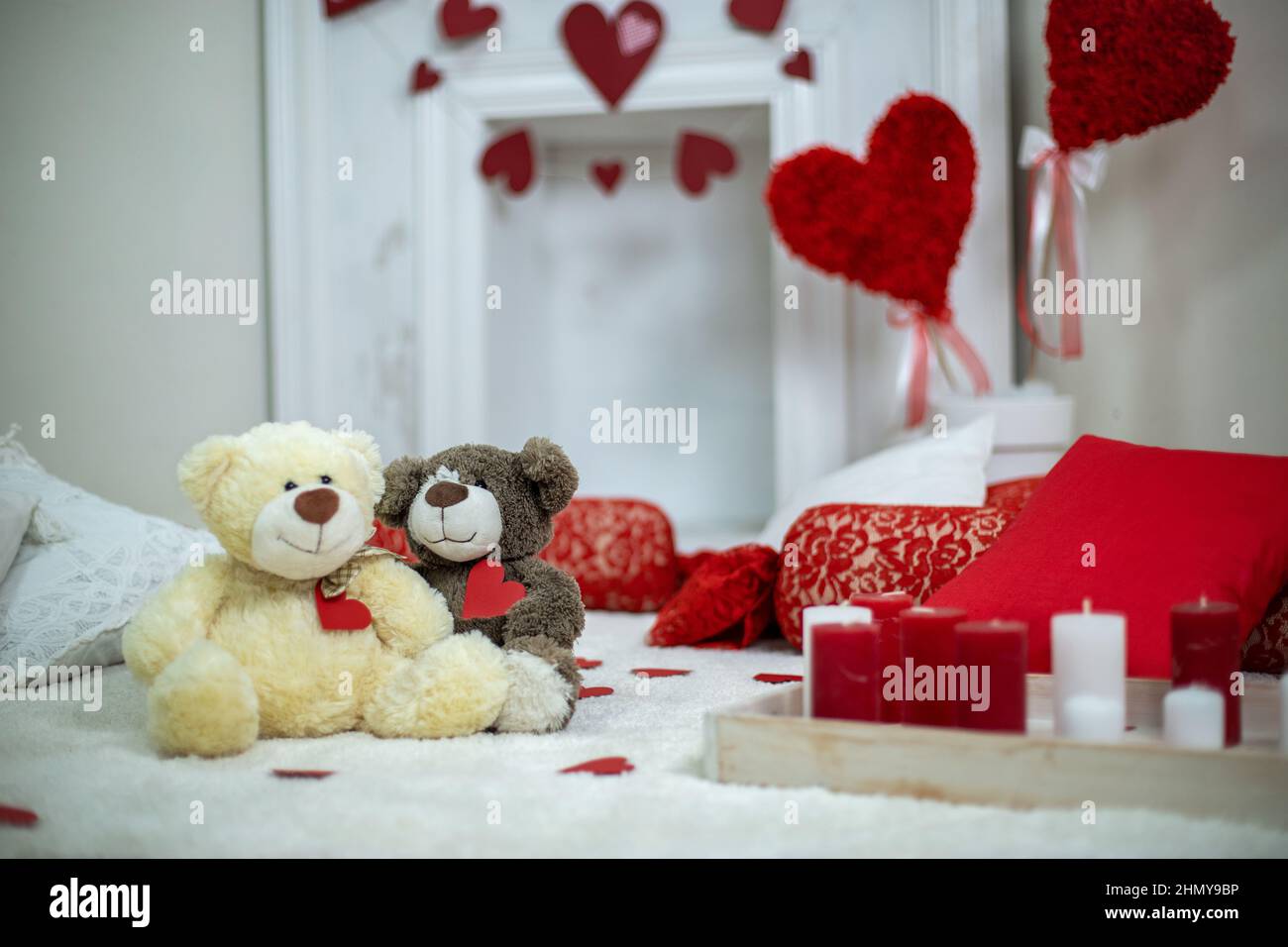 Candles in interior. Valentines day concept bears couple in love.Couple cute Teddy Bears loving, date.  Stock Photo