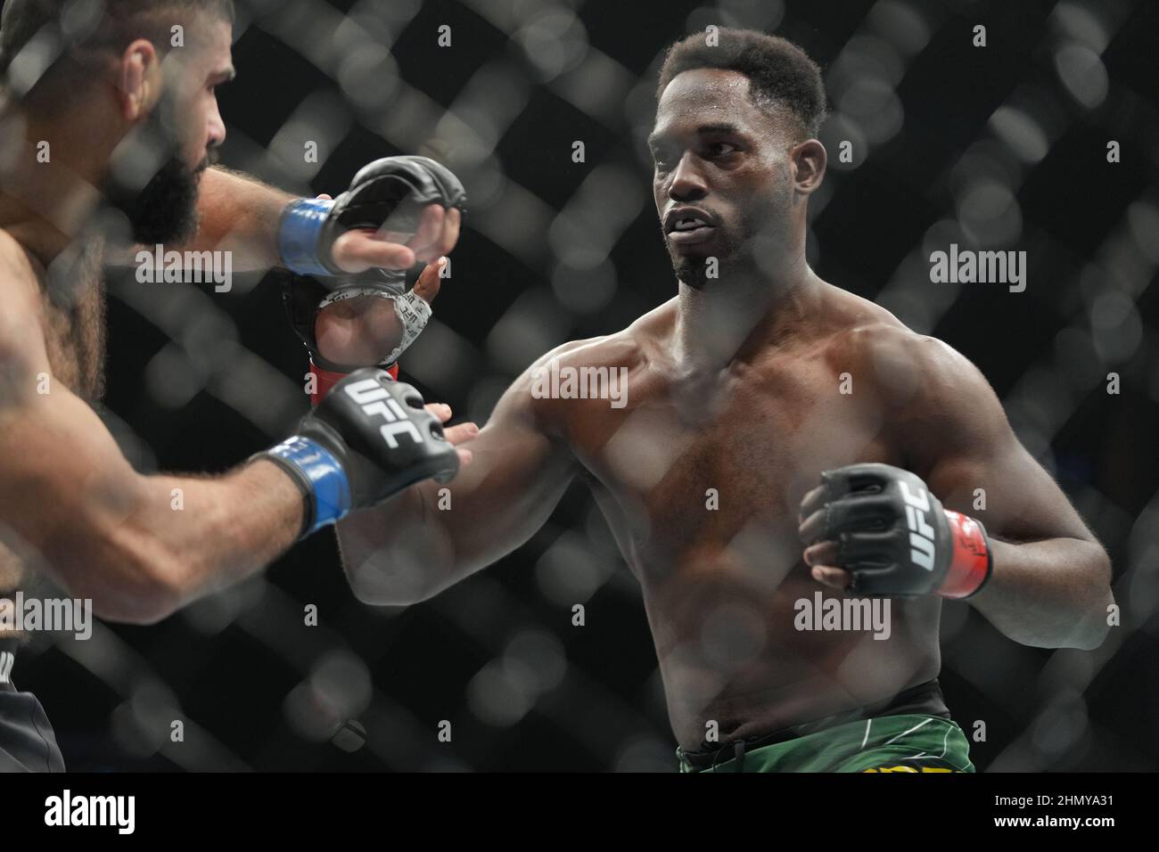 Houston, Texas, Houston, TX, USA. 12th Feb, 2022. HOUSTON, TX - FEBRUARY 12: (R-L) AJ Dobson battles Jacob Malkoun in their middleweight fight during the UFC 271 event at Toyota Center on February 12, 2022 in Houston, Texas, United States. (Credit Image: © Louis Grasse/PX Imagens via ZUMA Press Wire) Credit: ZUMA Press, Inc./Alamy Live News Stock Photo