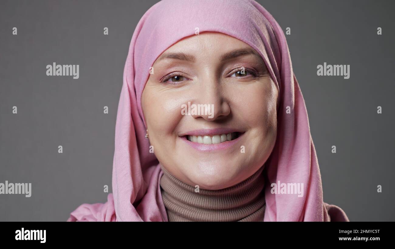 Young woman wearing pink hijab hi-res stock photography and images - Alamy