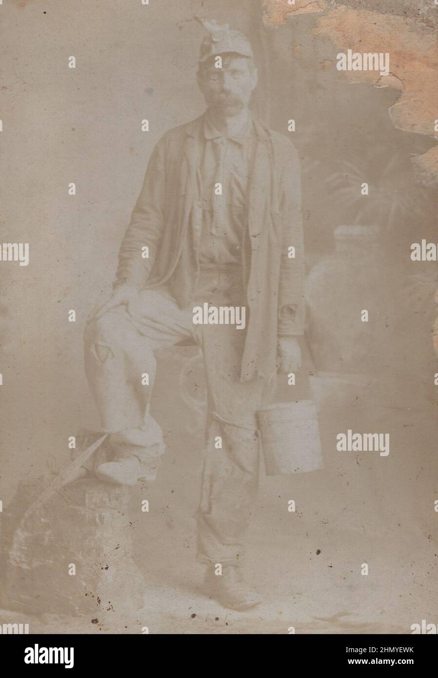 source: original photographs ADDITIONAL-RIGHTS-CLEARANCE-INFO-NOT-AVAILABLE :  antique 19th century photo about gold(?) or coal miner mid ages man with big moustache,  he has got bucket and picks. Stock Photo