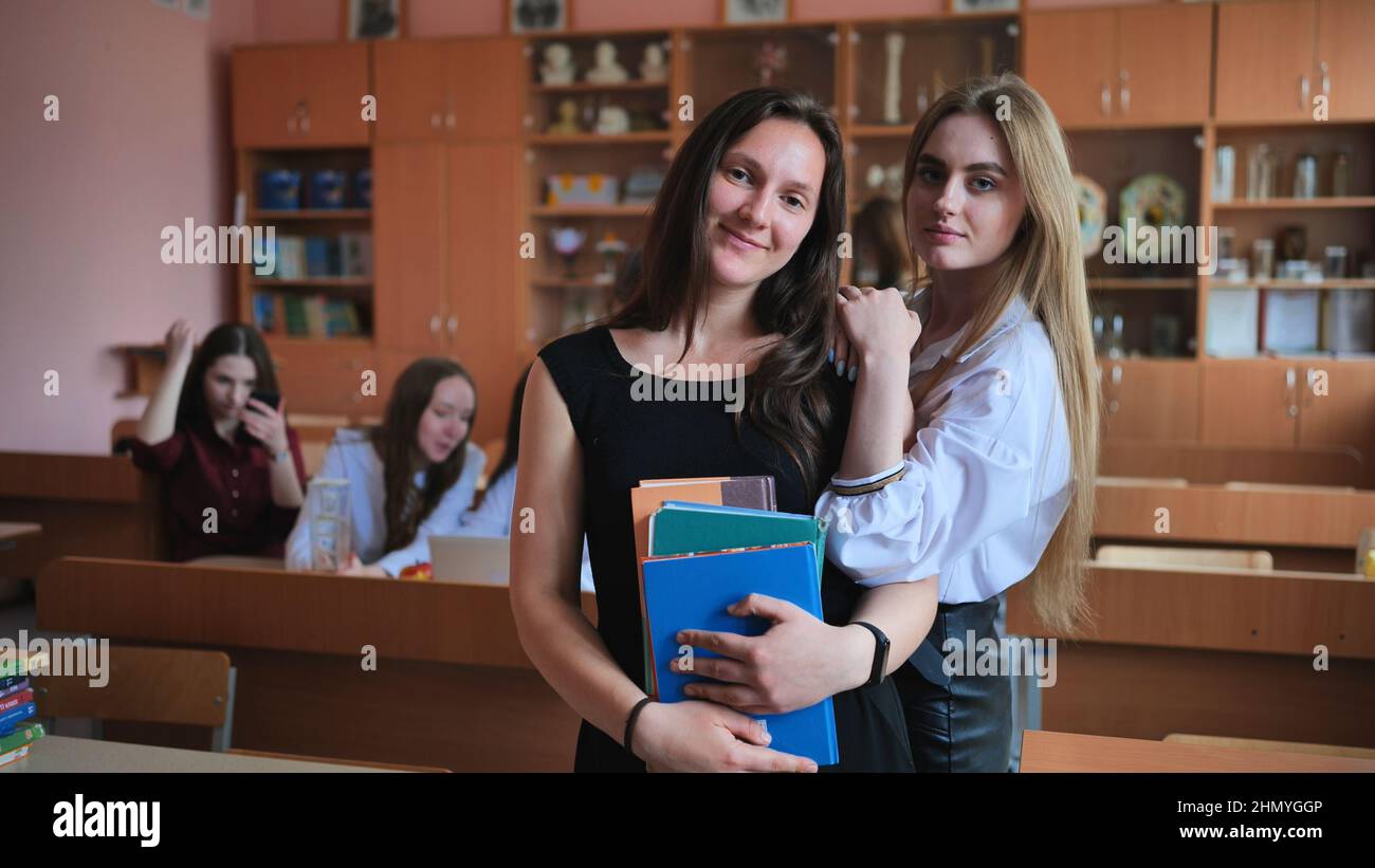 Beautiful female students are posing in the class Stock Photo Alamy