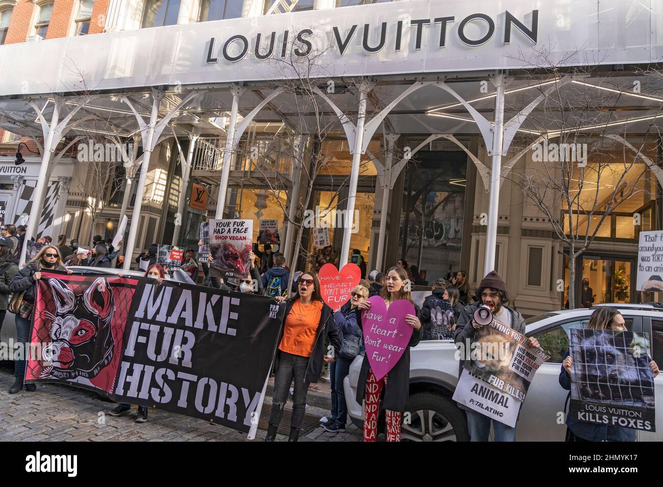 NEW YORK, NY - FEBRUARY 12: Animal Rights Protesters holding signs protest  in front of the Louis Vuitton store in SOHO during an Anti-Fur March on  February 12, 2022in New York City.
