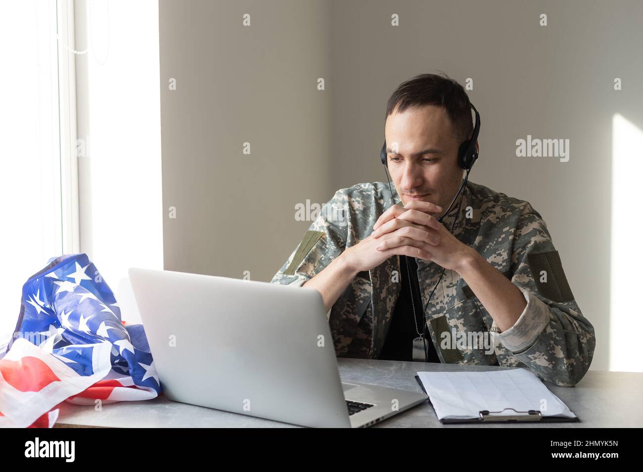 Soldier working with laptop in headquarters building Stock Photo - Alamy