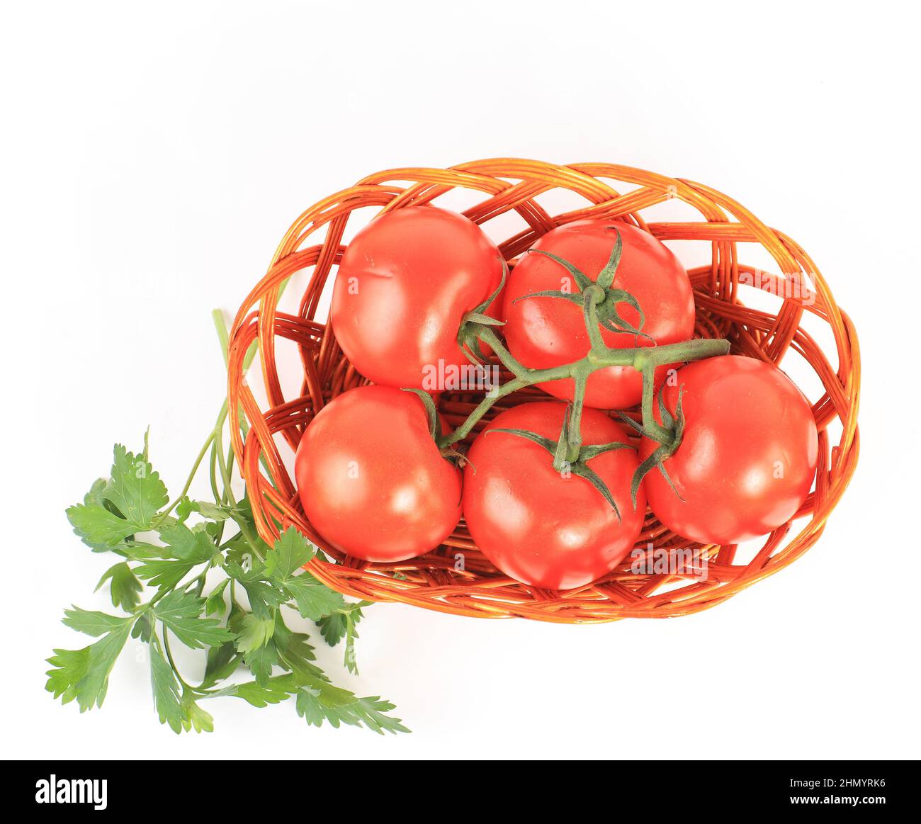 tomato vegetables and parsley leaves still life isolated on white background cutout Stock Photo