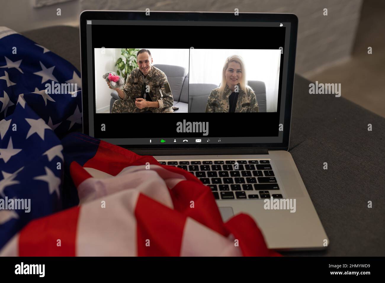 Mature male soldier using laptop in headquarters building for ...
