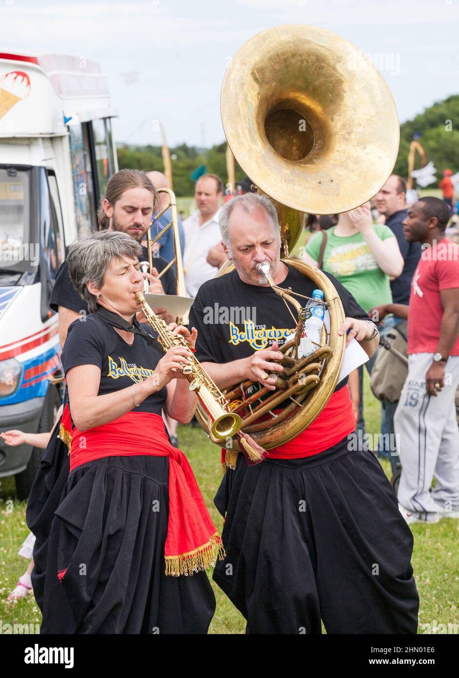 Musicians from Bollywood Brass Band play soprano saxophone and sousaphone at Washington Kite festival, north east  England, 2010 Stock Photo