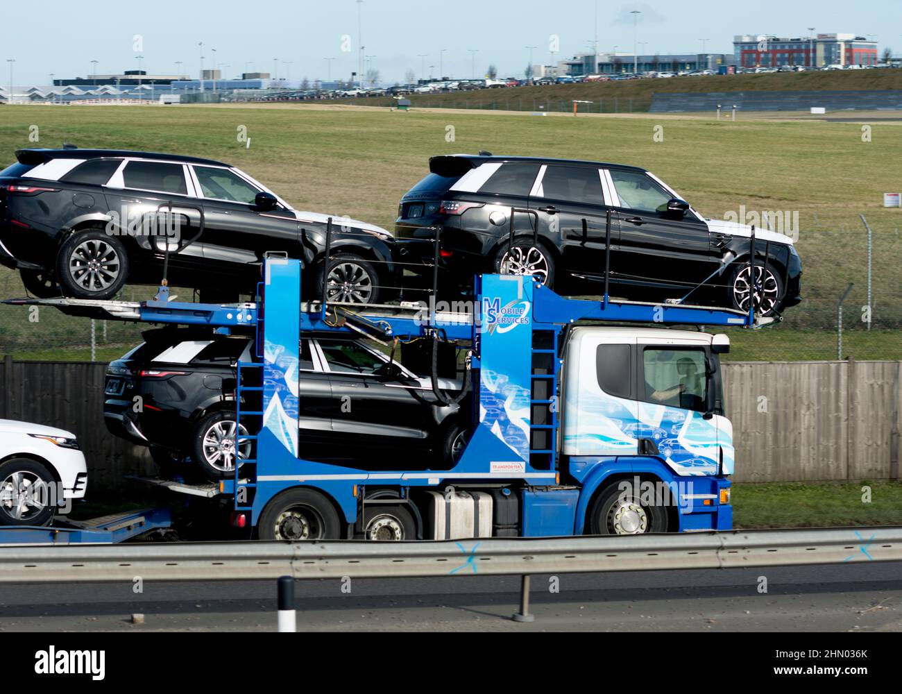 Mobile Services transporter lorry carrying new Land Rover cars, Birmingham, UK. Stock Photo