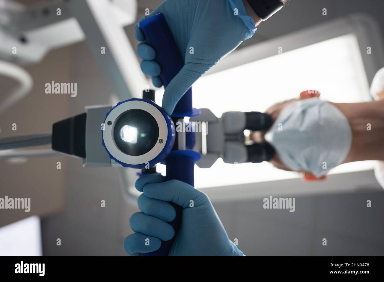 Dentist makes an operation using a dental microscope Stock Photo Alamy