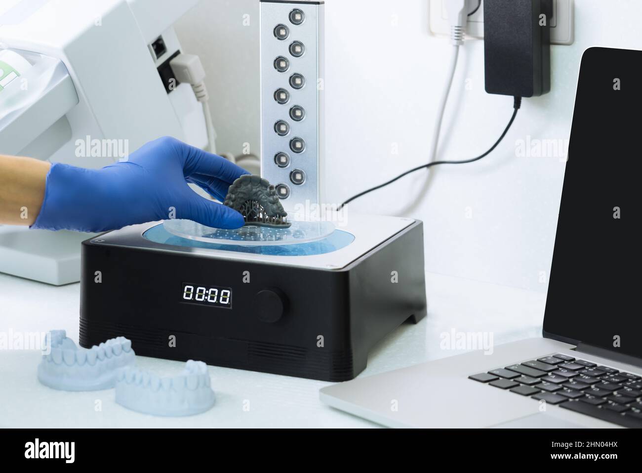 Dentist holds a 3d print of the jaw. Stock Photo