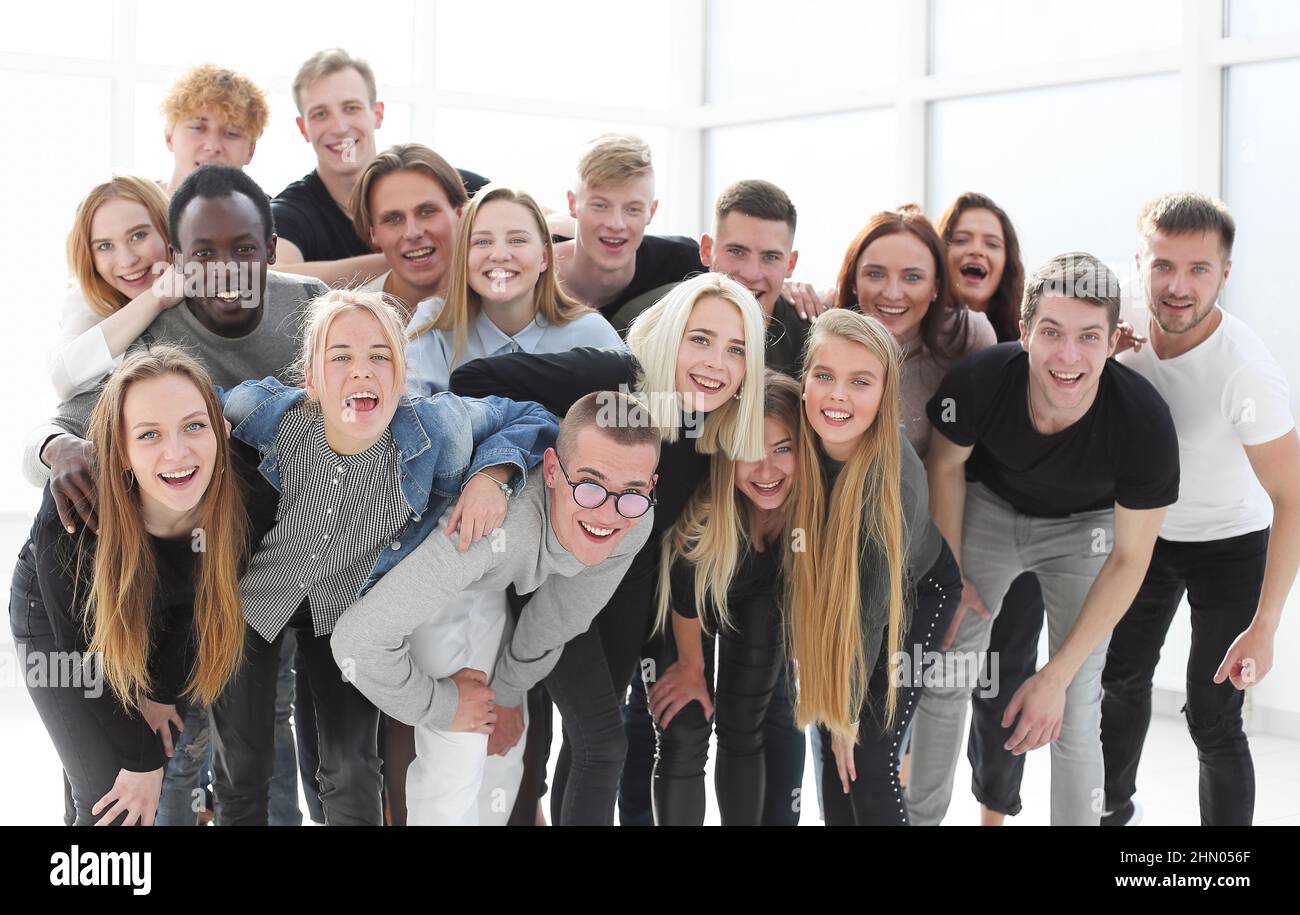 in full growth. happy young people standing together Stock Photo - Alamy