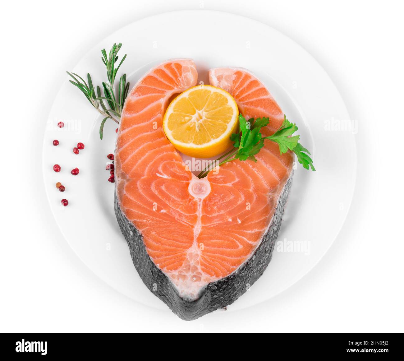 Raw salmon steak with lemon. Isolated on a white background Stock Photo ...