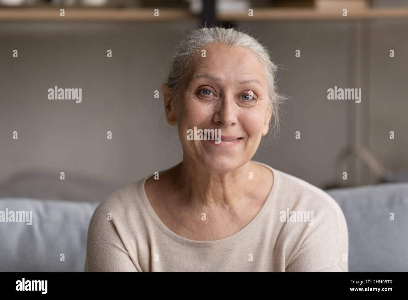 Smiling grey haired elder 70s lady head shot portrait Stock Photo Alamy