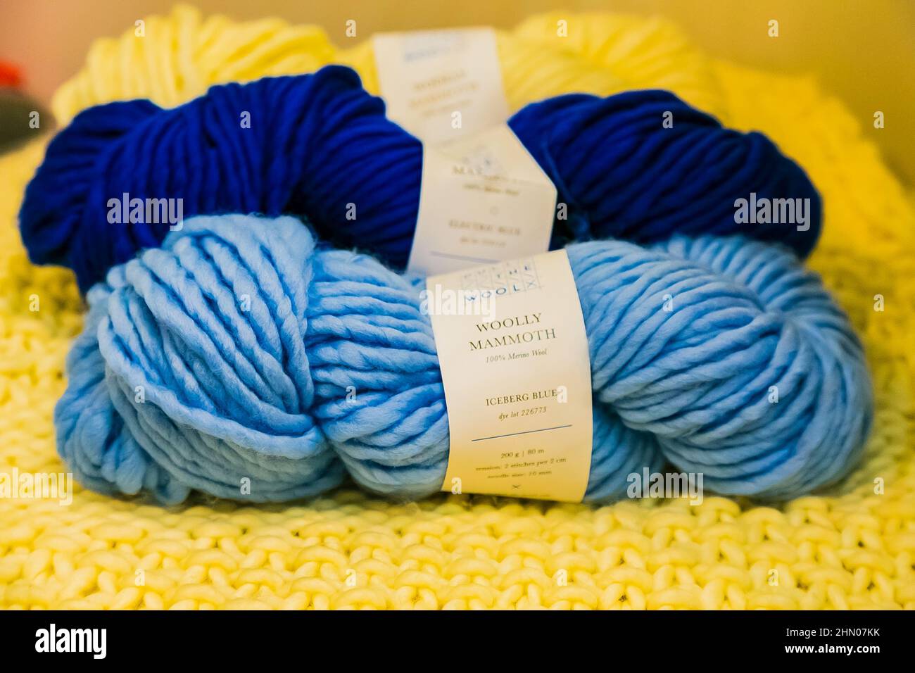 Blue yarns on display at an exhibitor stand at a handmade design fair