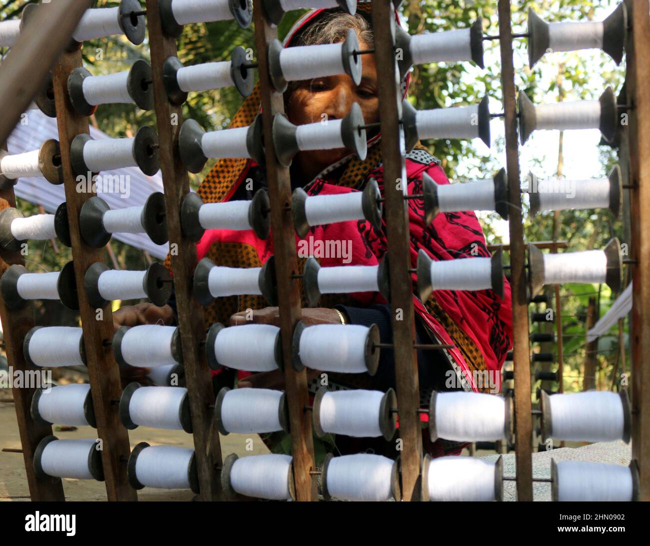 FEBRUARY 13,2022,DHAKA,BANGLADESHWorkers prepare yarn to make cloth