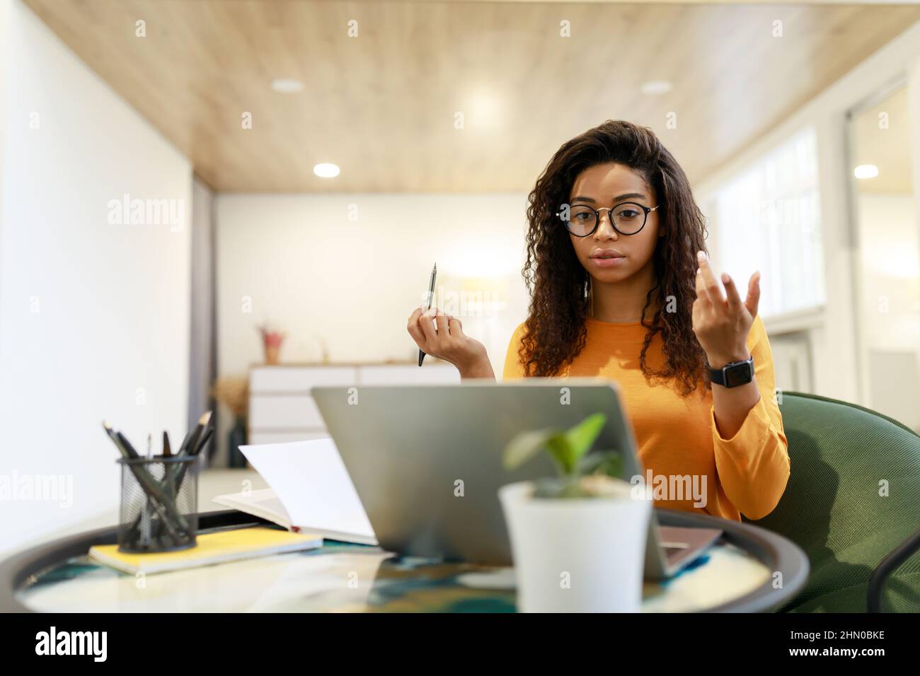 Black woman having video call using laptop and talking Stock Photo