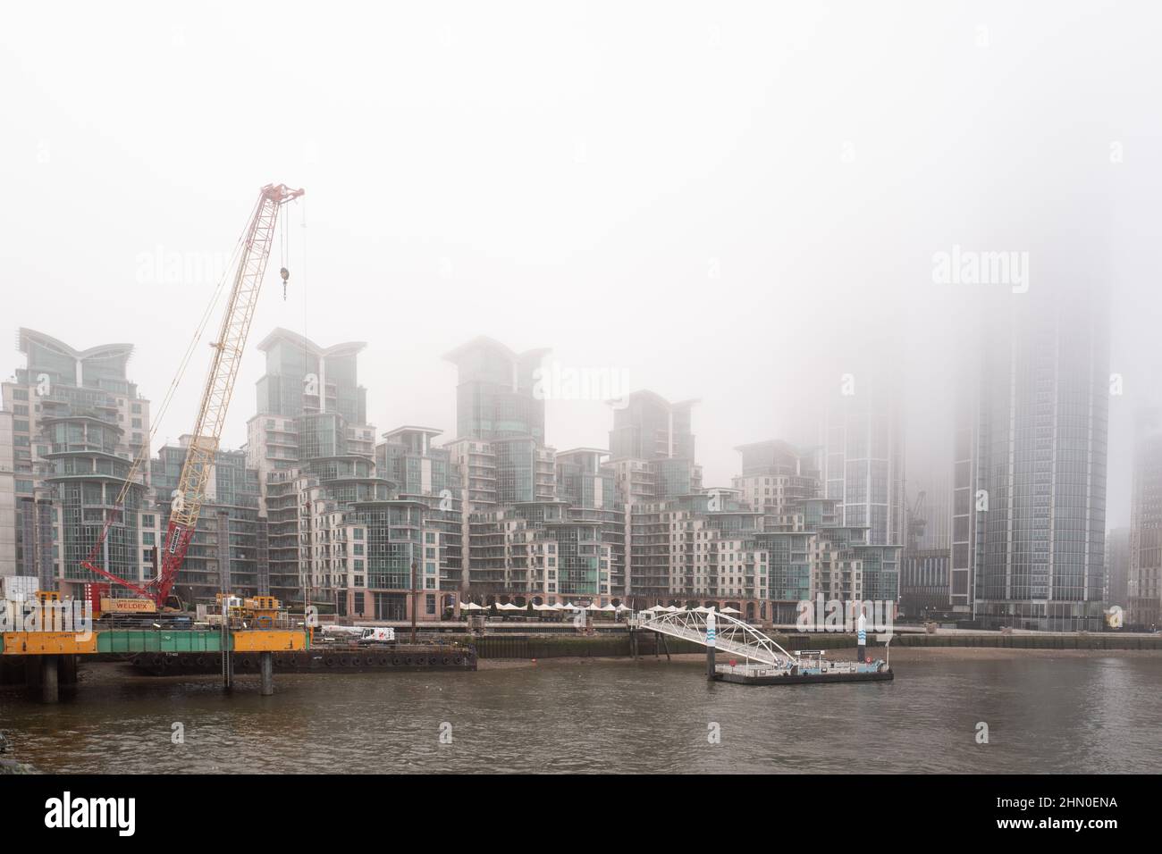 Waterfront development on the River Thames. Images taken from Vauxhall Bridge on a very damp and misty morning. Stock Photo