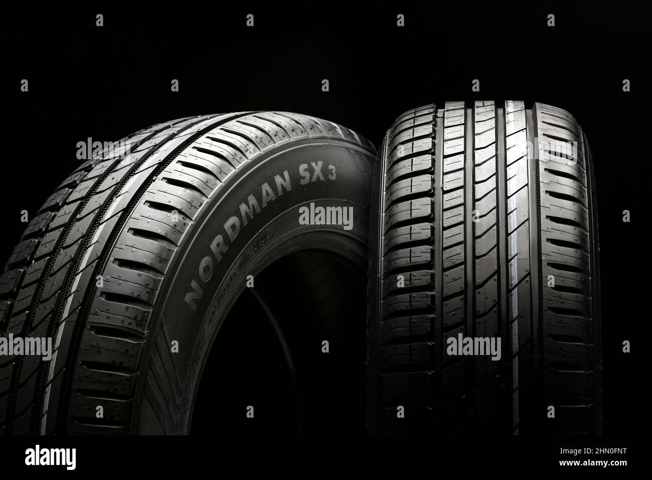 Krasnoyarsk, Russia, January 23, 2022: new Nordman sx 3 tires on a black background. Stock Photo