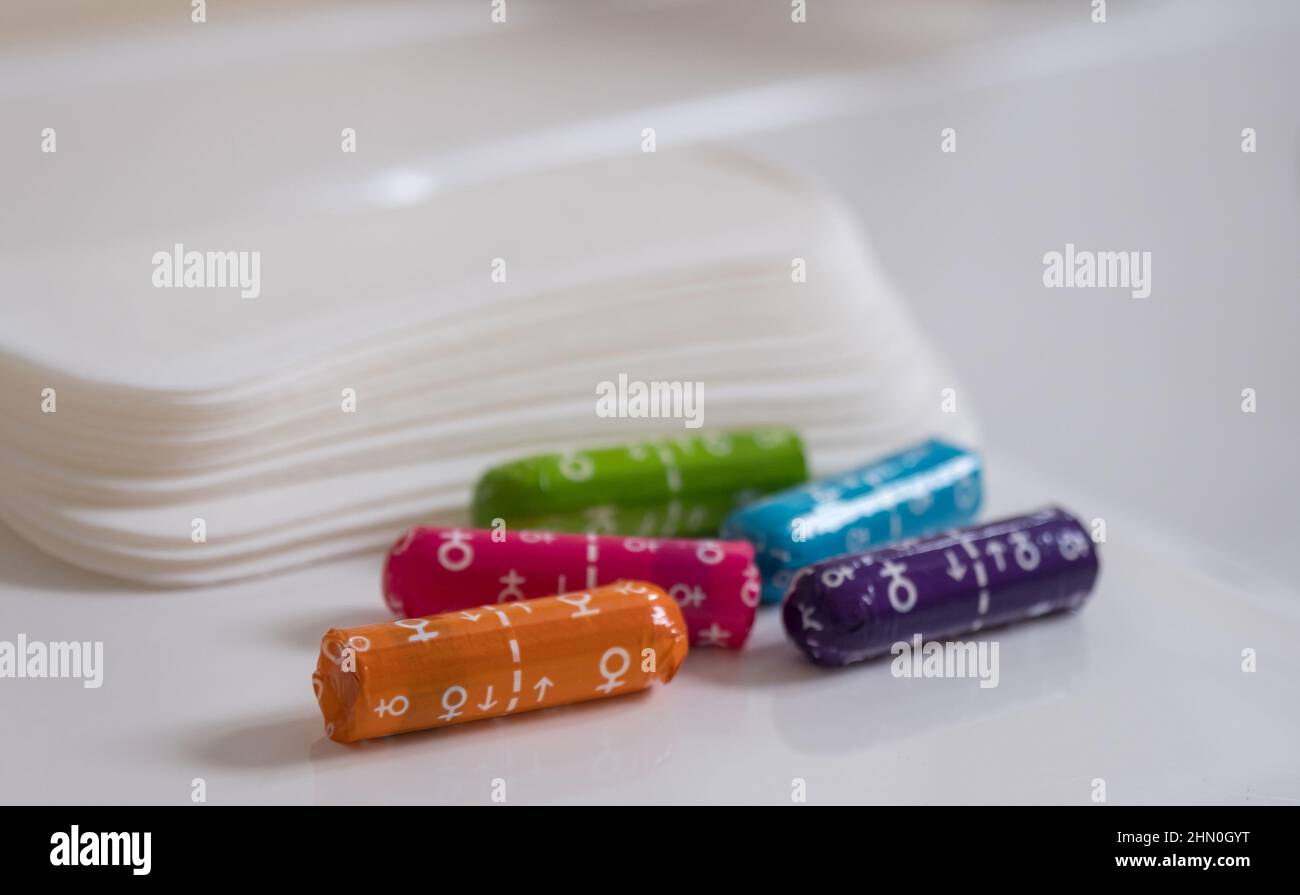 Female sanitary pads and medical female tampons on the bathroom table