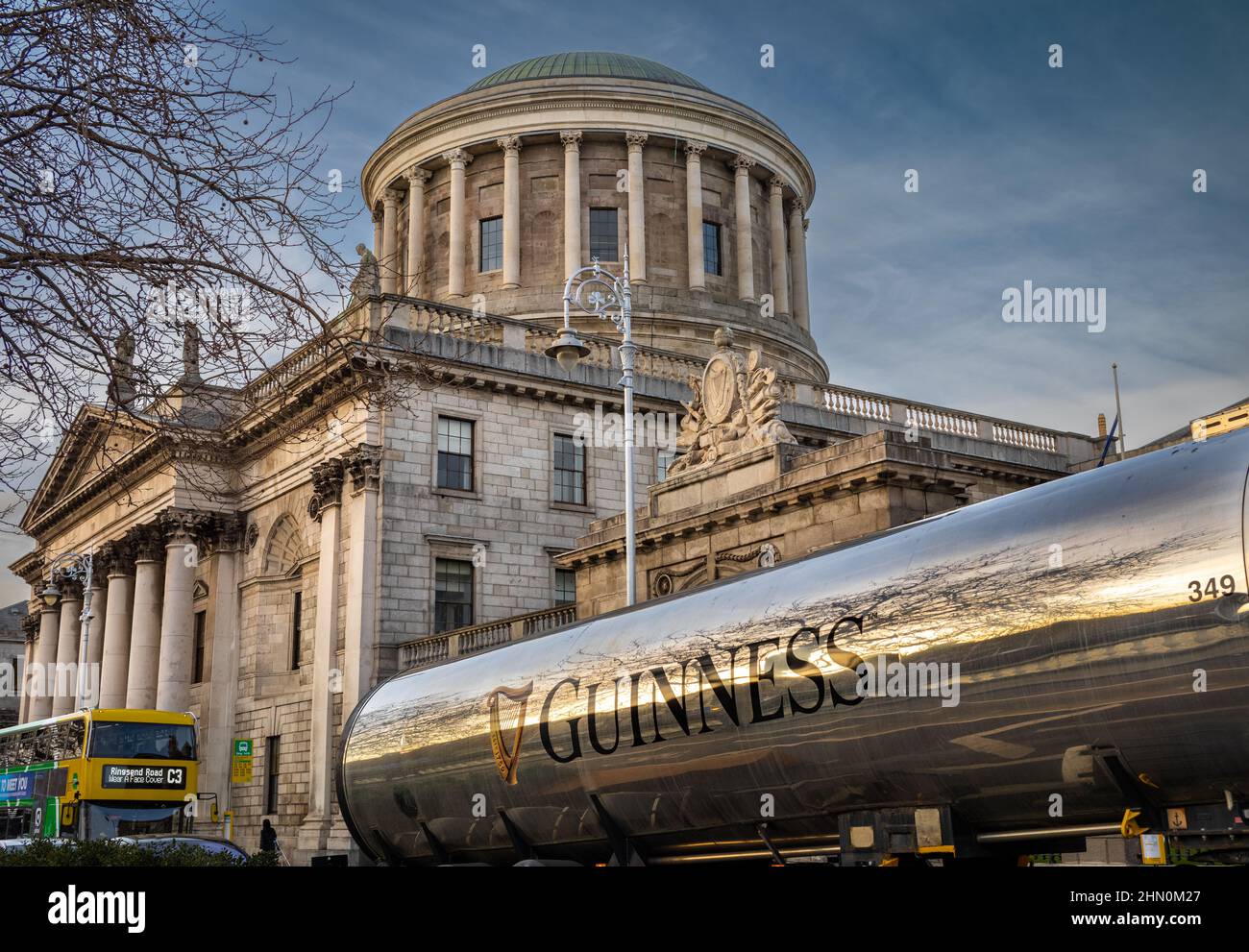 A Guinness beer tanker outside the historic Four Courts building on Inns Quay next to the River Liffey in Dublin, Ireland.  The Four Courts (Irish: Na Stock Photo